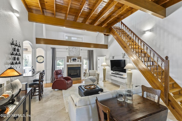 4 Pamela Pkwy, Palm Coast, FL 32137 - living room with stairs, wooden ceiling, a fireplace, baseboards, and beamed ceiling