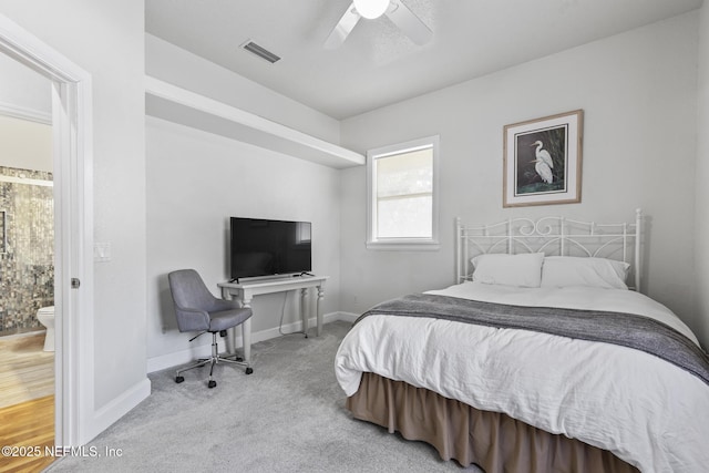 4 Pamela Pkwy, Palm Coast, FL 32137 - carpeted bedroom with baseboards, visible vents, ceiling fan, and ensuite bathroom