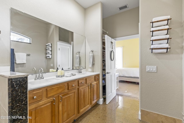 4 Pamela Pkwy, Palm Coast, FL 32137 - ensuite bathroom with a sink, ensuite bathroom, granite finish floor, and visible vents
