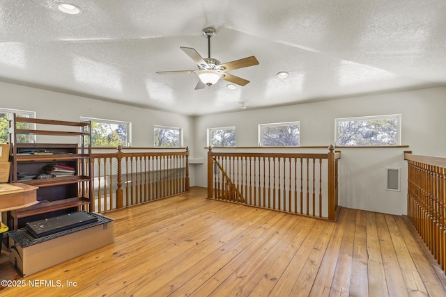 4 Pamela Pkwy, Palm Coast, FL 32137 - additional living space featuring plenty of natural light, hardwood / wood-style flooring, ceiling fan, and visible vents