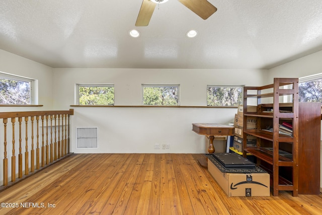4 Pamela Pkwy, Palm Coast, FL 32137 - interior space featuring wood-type flooring, a ceiling fan, plenty of natural light, and visible vents
