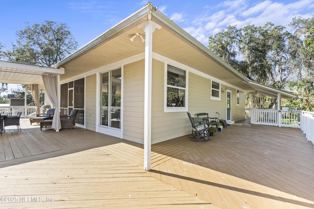 4 Pamela Pkwy, Palm Coast, FL 32137 - deck featuring a sunroom