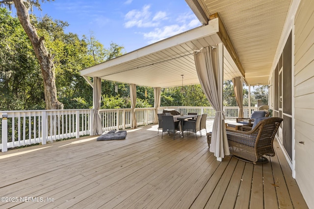 4 Pamela Pkwy, Palm Coast, FL 32137 - wooden deck featuring outdoor dining area