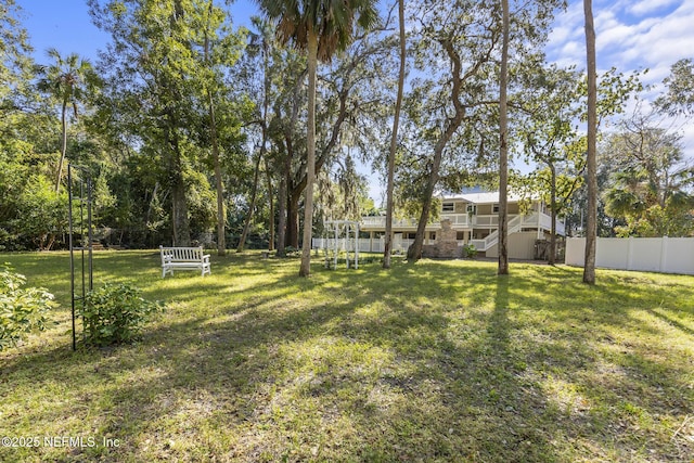 4 Pamela Pkwy, Palm Coast, FL 32137 - view of yard featuring stairs and fence