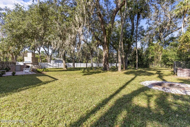 4 Pamela Pkwy, Palm Coast, FL 32137 - view of yard with a fenced backyard