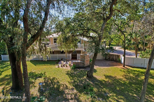 4 Pamela Pkwy, Palm Coast, FL 32137 - view of yard featuring a balcony and a fenced backyard