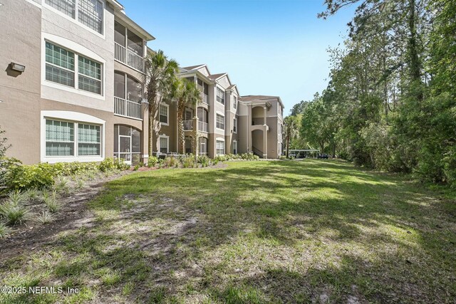view of community featuring a lawn