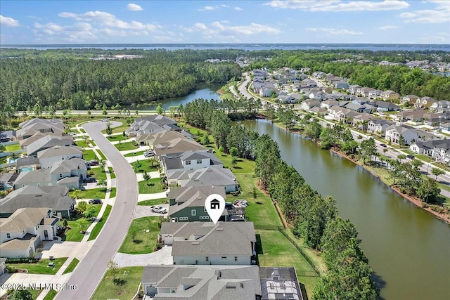 birds eye view of property featuring a water view and a residential view
