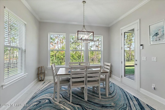 dining room with a notable chandelier and a healthy amount of sunlight