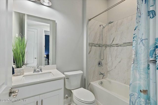 bathroom with toilet, shower / bath combo, and vanity