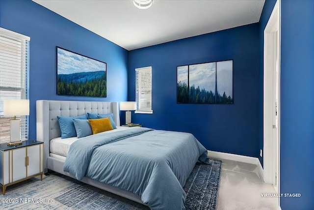 carpeted bedroom with baseboards