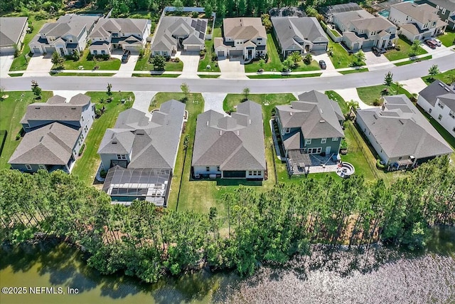 birds eye view of property with a residential view