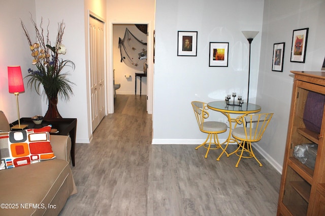 dining area featuring baseboards and wood finished floors