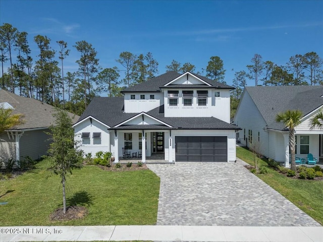 508 Palm Crest Dr, Ponte Vedra, FL 32081 - view of front of house featuring a porch, decorative driveway, a garage, and a front yard