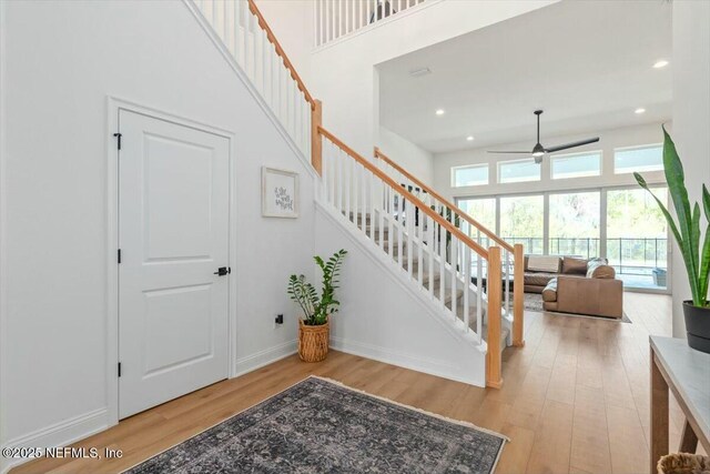 508 Palm Crest Dr, Ponte Vedra, FL 32081 - stairway with wood finished floors, ceiling fan, a towering ceiling, baseboards, and recessed lighting