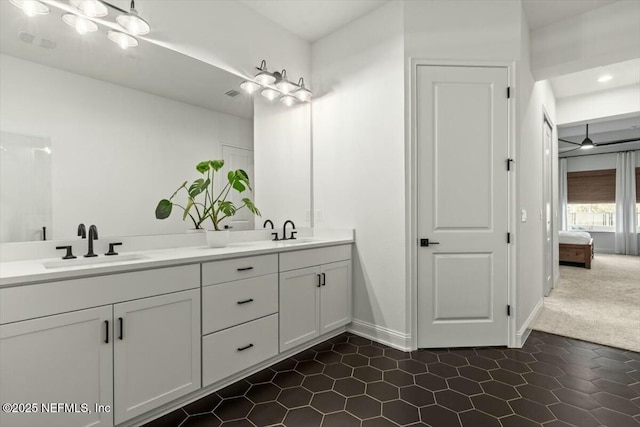 508 Palm Crest Dr, Ponte Vedra, FL 32081 - ensuite bathroom featuring tile patterned floors, double vanity, and baseboards