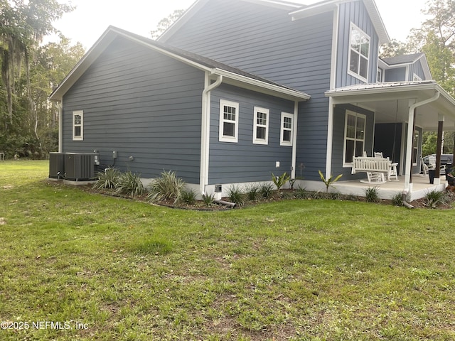 104 W Grandview Dr, East Palatka, FL 32131 - view of property exterior featuring central air condition unit and a yard