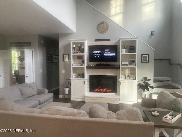 104 W Grandview Dr, East Palatka, FL 32131 - living room featuring wood finished floors and a glass covered fireplace