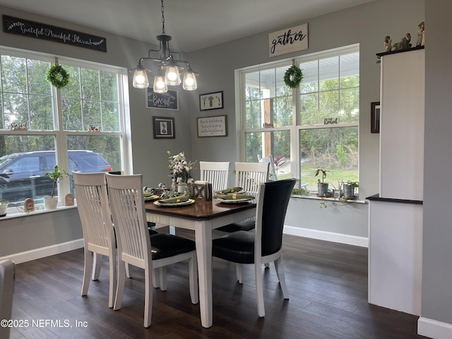 104 W Grandview Dr, East Palatka, FL 32131 - dining area featuring baseboards, a chandelier, and dark wood finished floors