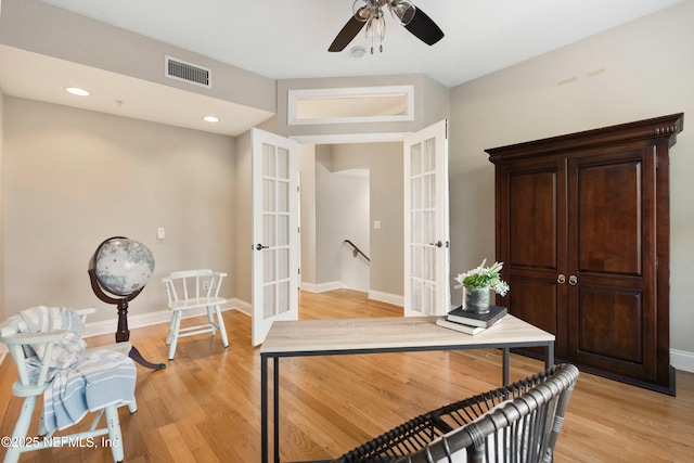 hallway featuring light wood-type flooring, french doors, baseboards, visible vents, and recessed lighting