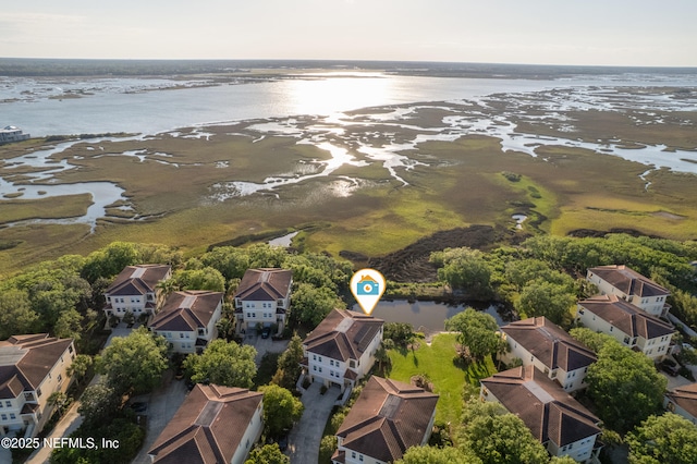 birds eye view of property featuring a residential view and a water view
