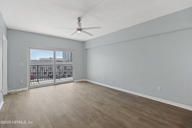 731 1st St S Unit 311, Jacksonville Beach, FL 32250 - spare room with baseboards, wood finished floors, and a ceiling fan