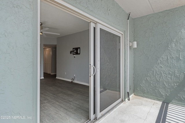 731 1st St S Unit 311, Jacksonville Beach, FL 32250 - bathroom featuring a ceiling fan, a textured wall, baseboards, and wood finished floors
