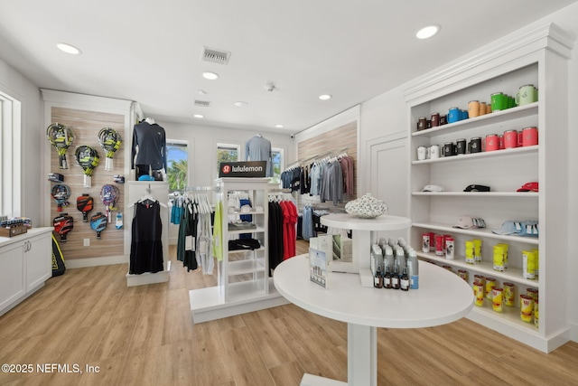 interior space featuring visible vents, open shelves, and light wood-style flooring