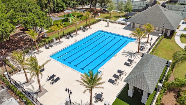 pool featuring a patio area and fence
