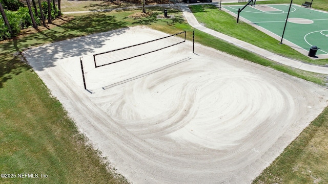 surrounding community featuring fence, a yard, community basketball court, and a tennis court