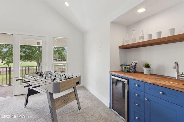 4520 Swilcan Bridge Ln N, Jacksonville, FL 32224 - rec room featuring beverage cooler, bar, light colored carpet, lofted ceiling, and recessed lighting