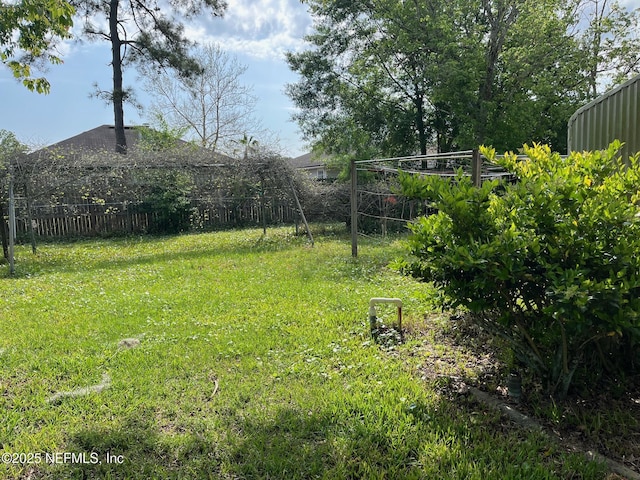 view of yard with fence