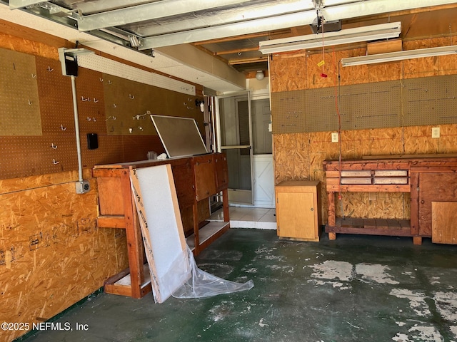 interior space with a garage and a workshop area