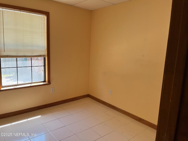 unfurnished room featuring baseboards