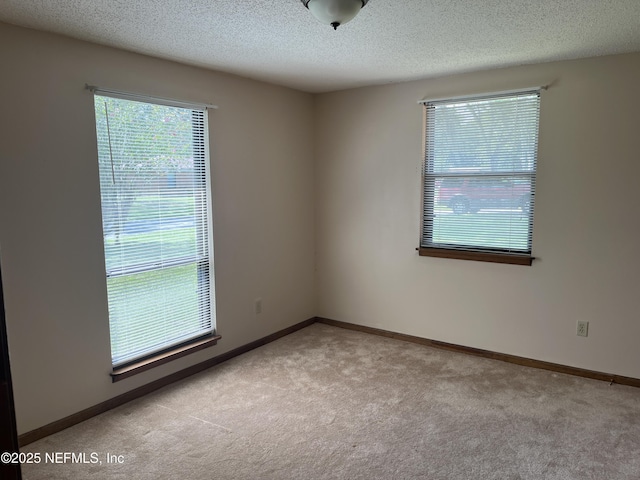 1933 Timucua Trl, Middleburg, FL 32068 - empty room with carpet floors and a textured ceiling