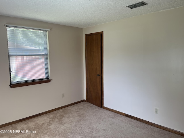 1933 Timucua Trl, Middleburg, FL 32068 - spare room featuring carpet and a textured ceiling