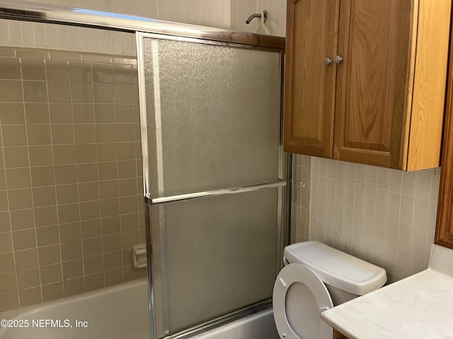 1933 Timucua Trl, Middleburg, FL 32068 - bathroom featuring enclosed tub / shower combo, vanity, decorative backsplash, and tile walls