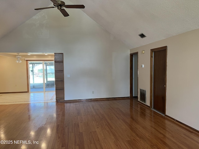 1933 Timucua Trl, Middleburg, FL 32068 - spare room featuring high vaulted ceiling, a ceiling fan, wood finished floors, and a textured ceiling