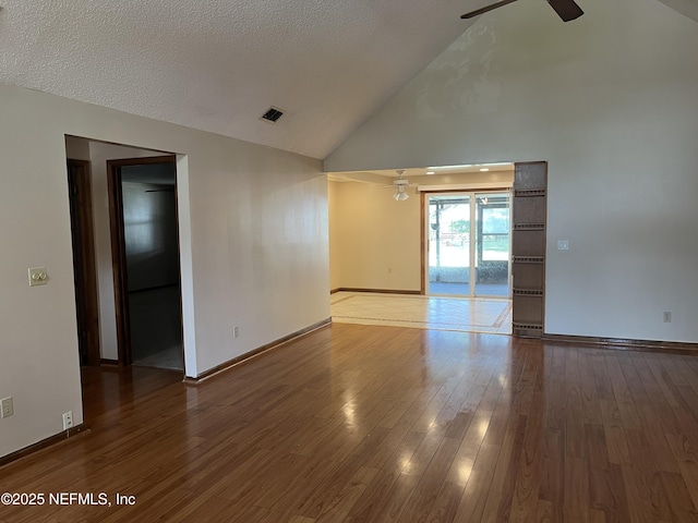 1933 Timucua Trl, Middleburg, FL 32068 - spare room featuring a ceiling fan, wood finished floors, and high vaulted ceiling