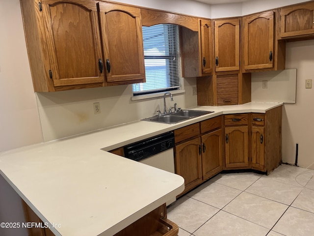 1933 Timucua Trl, Middleburg, FL 32068 - kitchen featuring a peninsula, light countertops, and brown cabinetry