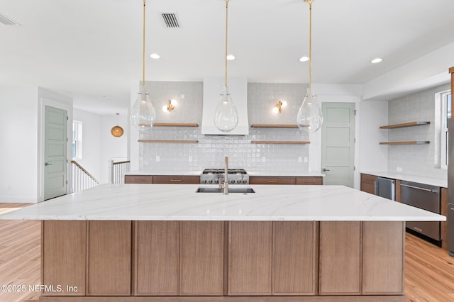 7 13th St, Saint Augustine, FL 32080 - kitchen with open shelves, backsplash, light wood-style floors, and recessed lighting