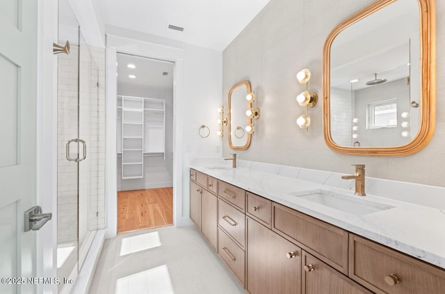 7 13th St, Saint Augustine, FL 32080 - full bath with a stall shower, double vanity, a spacious closet, and recessed lighting