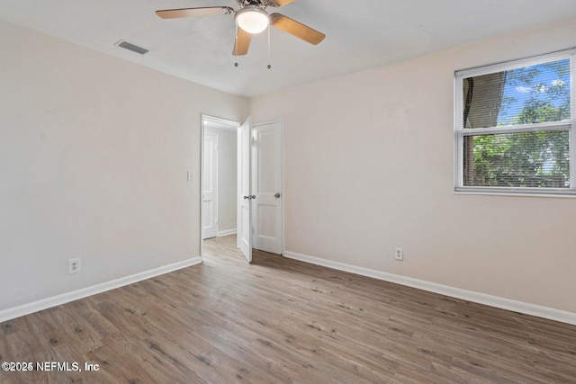 3047 Post St, Jacksonville, FL 32205 - spare room featuring a ceiling fan, wood finished floors, baseboards, and visible vents