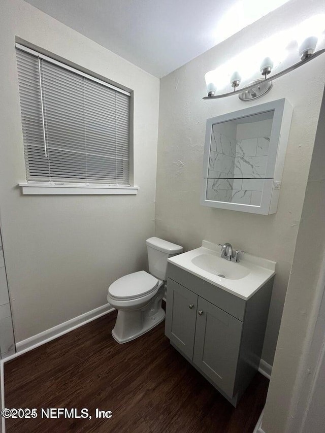 3047 Post St, Jacksonville, FL 32205 - bathroom featuring toilet, wood finished floors, baseboards, and vanity