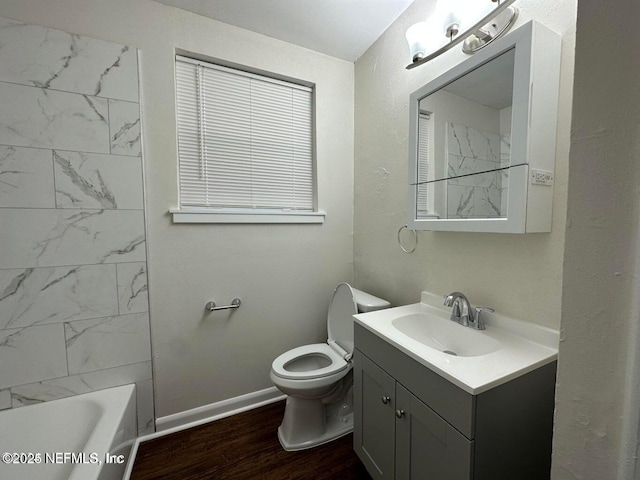 3047 Post St, Jacksonville, FL 32205 - bathroom featuring baseboards, wood finished floors, toilet, and vanity