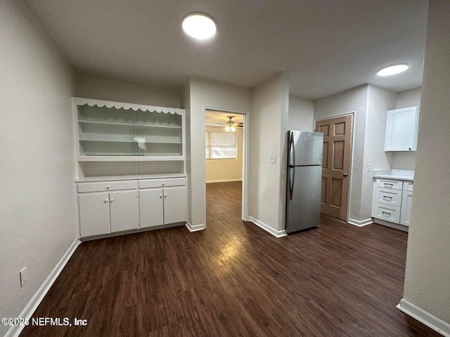 3047 Post St, Jacksonville, FL 32205 - kitchen featuring baseboards, white cabinets, dark wood-type flooring, and freestanding refrigerator