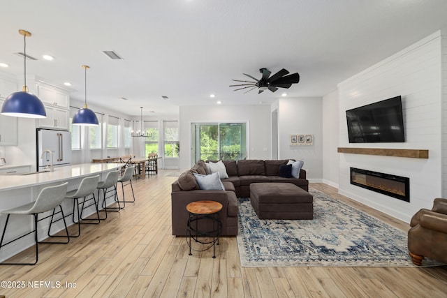 489 Windley Dr, Saint Augustine, FL 32092 - living room with light wood finished floors, a fireplace, visible vents, and recessed lighting