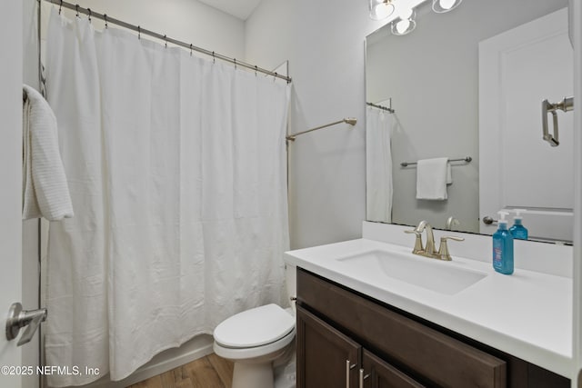 489 Windley Dr, Saint Augustine, FL 32092 - full bathroom with vanity, toilet, and wood finished floors