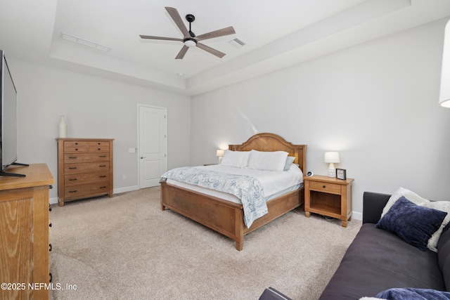 489 Windley Dr, Saint Augustine, FL 32092 - bedroom with visible vents, baseboards, a raised ceiling, a ceiling fan, and light carpet