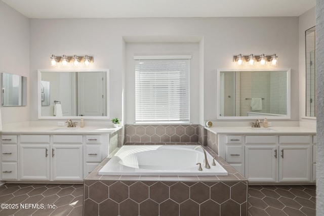 489 Windley Dr, Saint Augustine, FL 32092 - bathroom featuring two vanities, a sink, and a garden tub